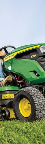 Lady riding John Deere ride-on mower