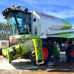 A Claas combine harvester being cleaned for export